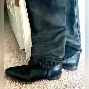 Gucci Black Calf Leather Interlocking GG flat knee high boots.